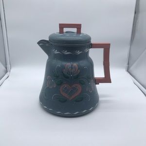 Metal decorative pitcher.